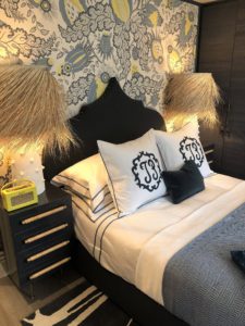 A guest bedroom by Turner Pocock LTD mixed punchy colour - those zingy yellow accents - with print and pattern.